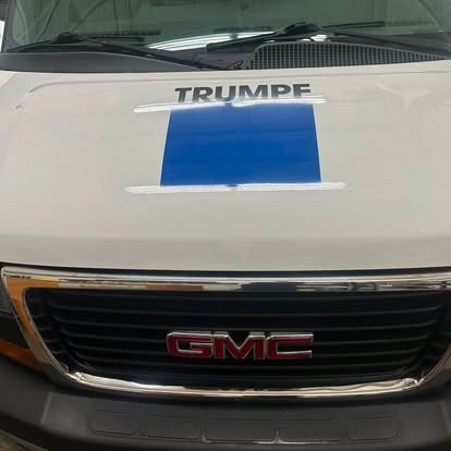 Polished hood of a local corporate fleet van after detailing by Tony
