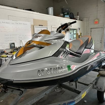 Detailed personal watercraft on a trailer in Tony’s shop