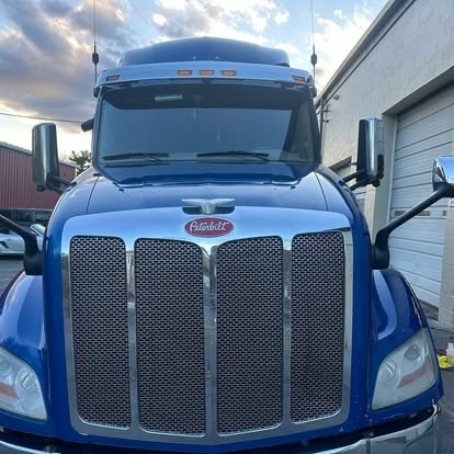 Front of a blue Peterbilt semi after detailing by Tony