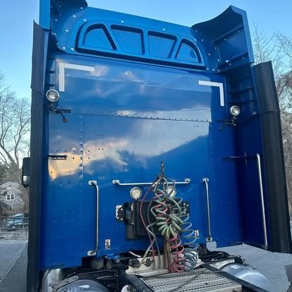 Rear of a blue semi cab after detailing by Tony