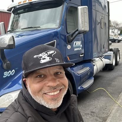 Tony with a blue semi tractor after detailing